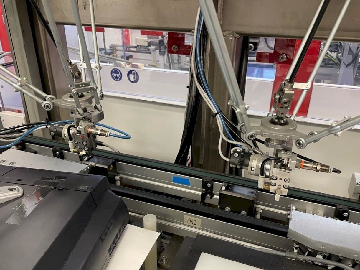 Vista frontale della macchina IMS Tattoo Assembly Line