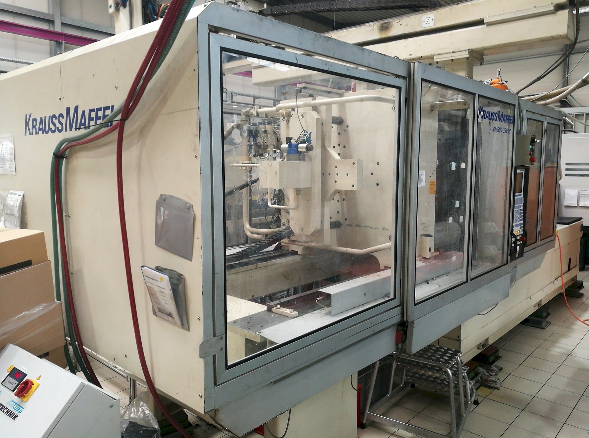 Vista lato sinistro della macchina Krauss Maffei KM 500-3500 C1