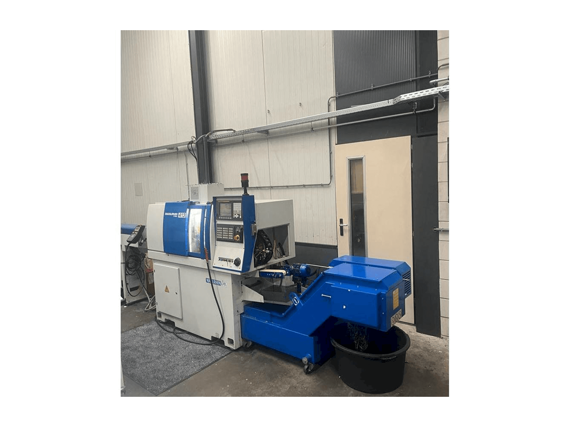 Vista frontale della macchina Manurhin K'MX 413