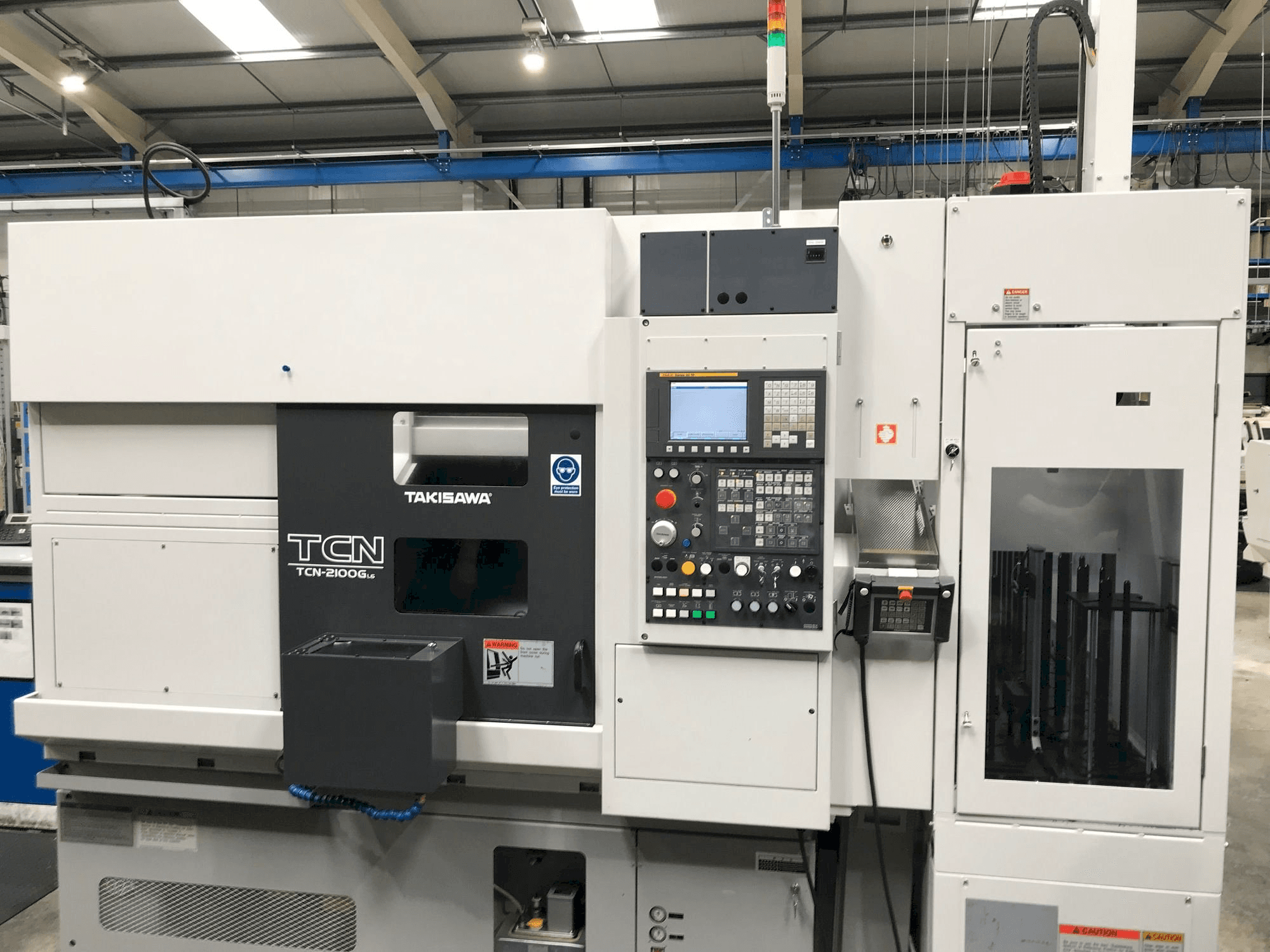 Vista frontale della macchina Takisawa TCN-2100G L6